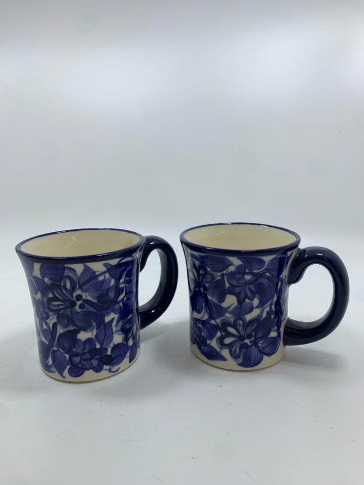 2 NAVY FLORAL PAINTED MUGS.