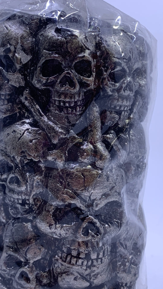 NIP STACKED SKULLS PILLAR CANDLE.