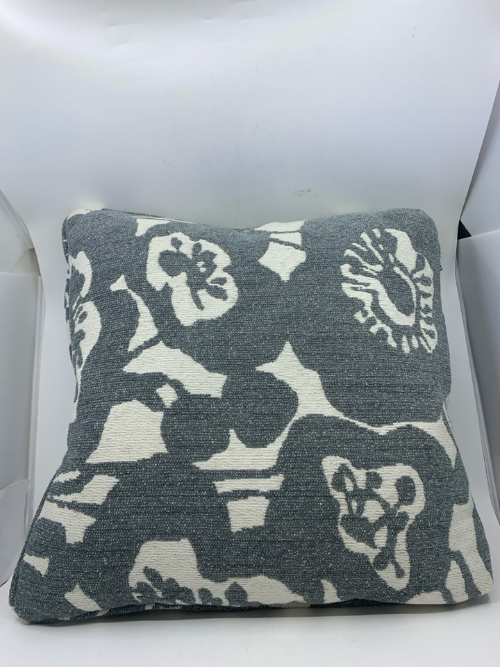 WHITE W/ BLUE/GRAY FLORAL PATTERN PILLOW.