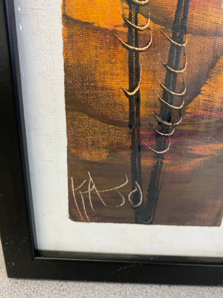 RED WARRIOR PAINT PRINT IN BLACK FRAME.