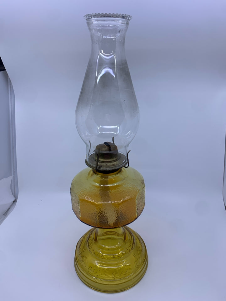 VTG AMBER GLASS OIL LAMP.