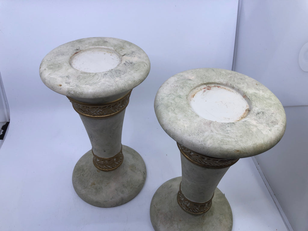 2 WHITE STONE W/GOLD DETAIL PILLAR CANDLE HOLDERS.
