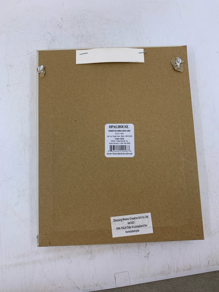 THIS IS US IN GOLD WRITING FRAMED CANVAS.