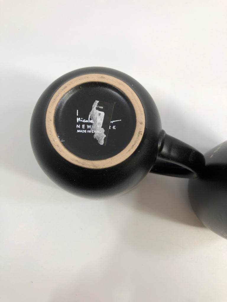 2 BLACK LIMITLESS COFFEE MUGS.