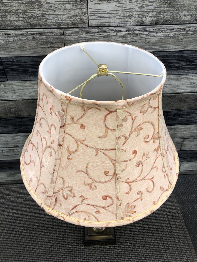 TARNISHED BRASS BASE LAMP W/ PEACH SCROLL SHADE.