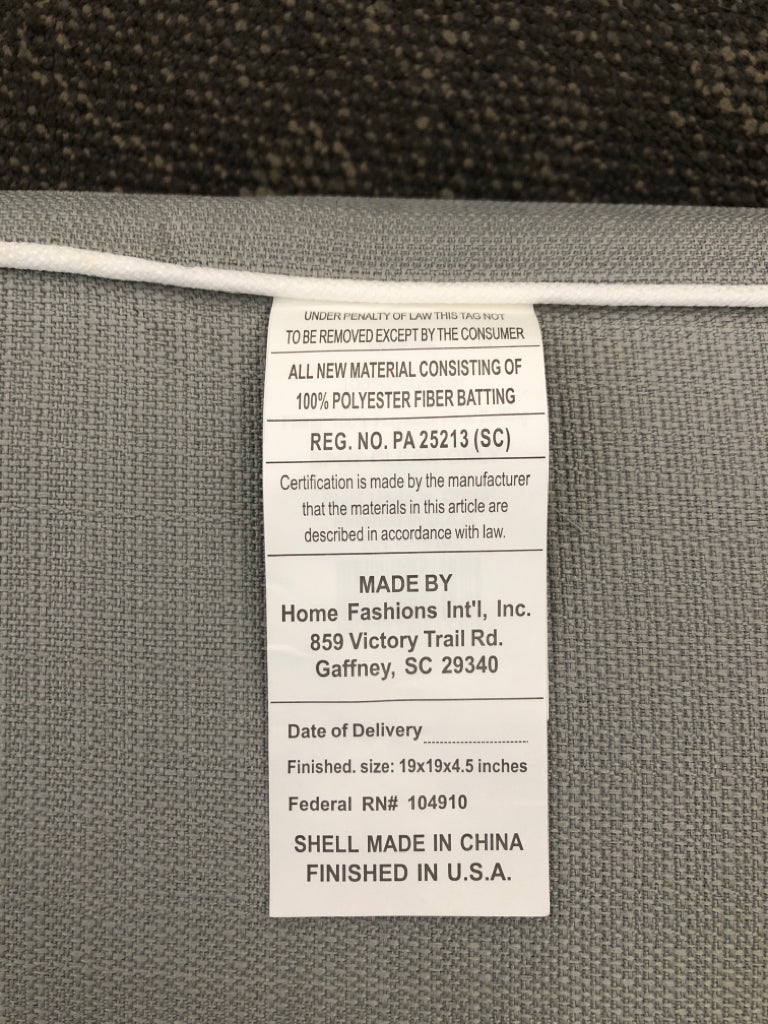 GRAY SEAT CUSHION W/WHITE TRIM.