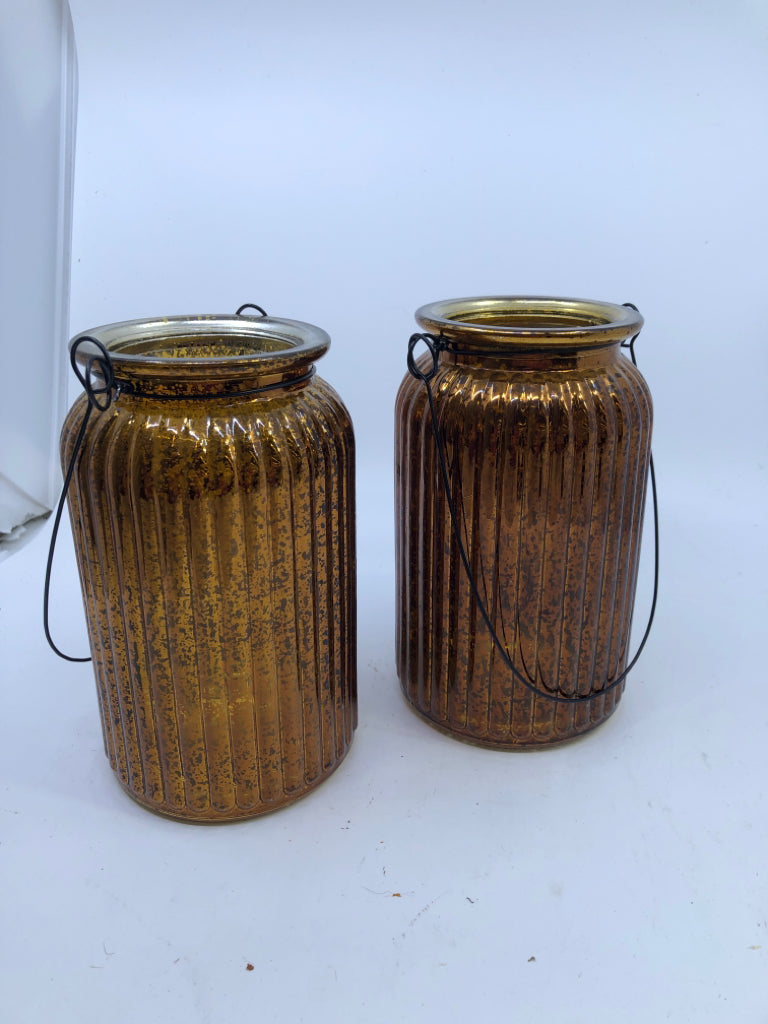 2 TALL GOLDEN MERCURY GLASS CANDLE HOLDER W/WIRE HANDLE.