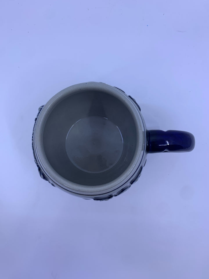 COREZELIUS COBALT BLUE MUG W/ GRAY DESIGNS.