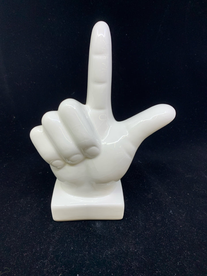 WHITE L SHAPED HAND FIGURE.