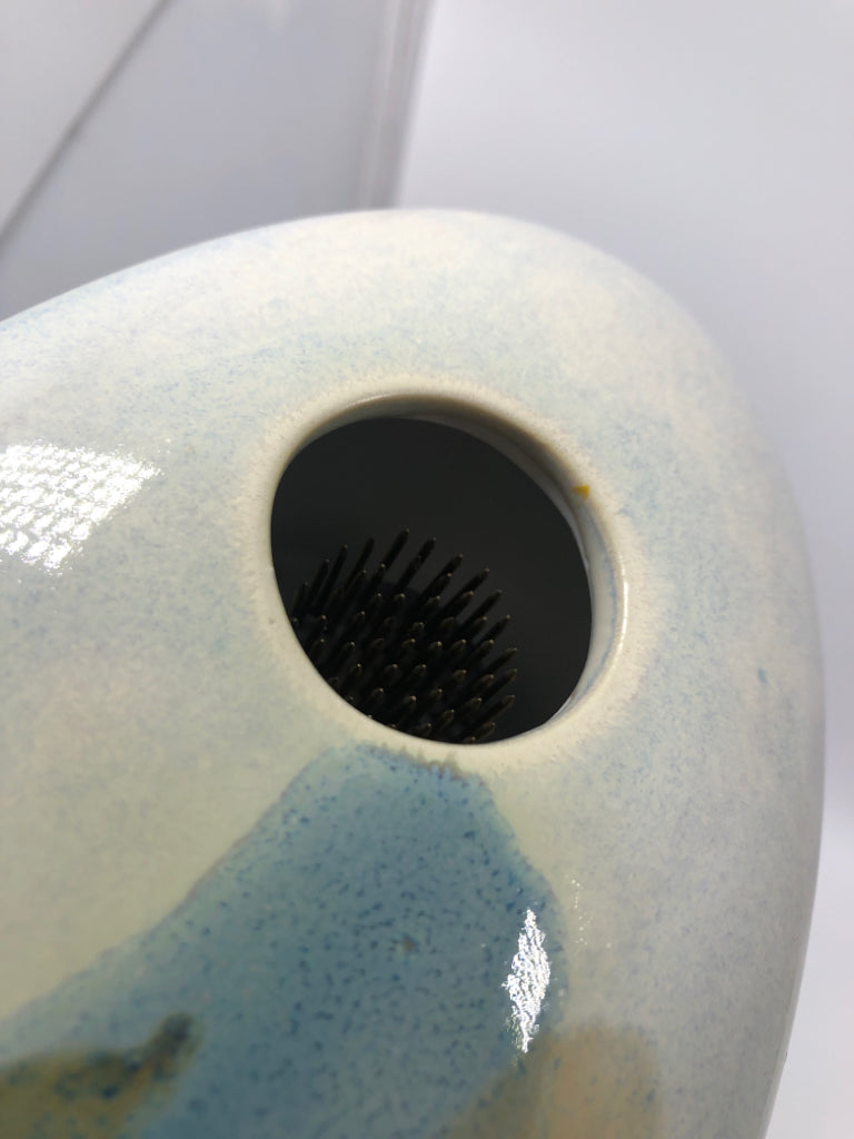 LIGHT BLUE CERAMIC FLOWER FROG.