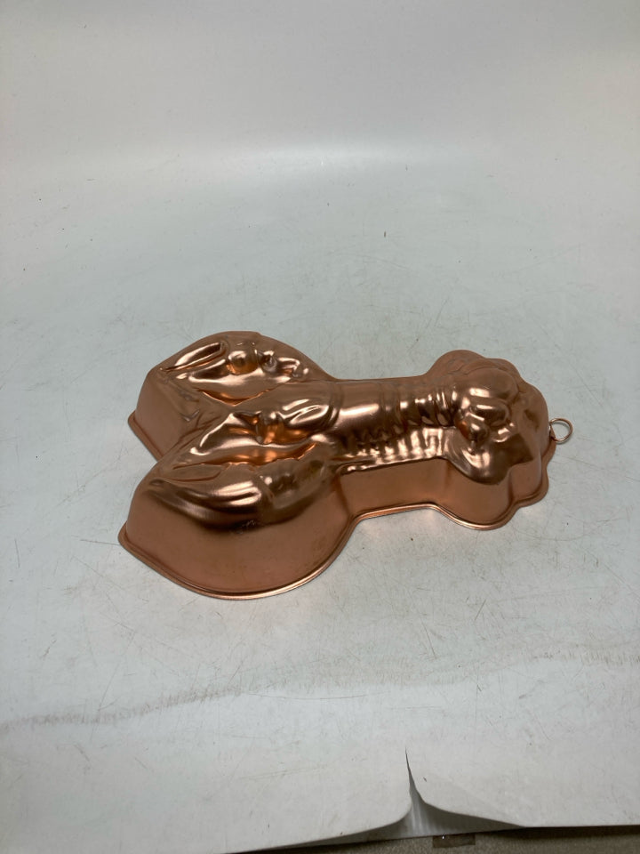 LOBSTER SHAPED COPPER COLORED MOLD.