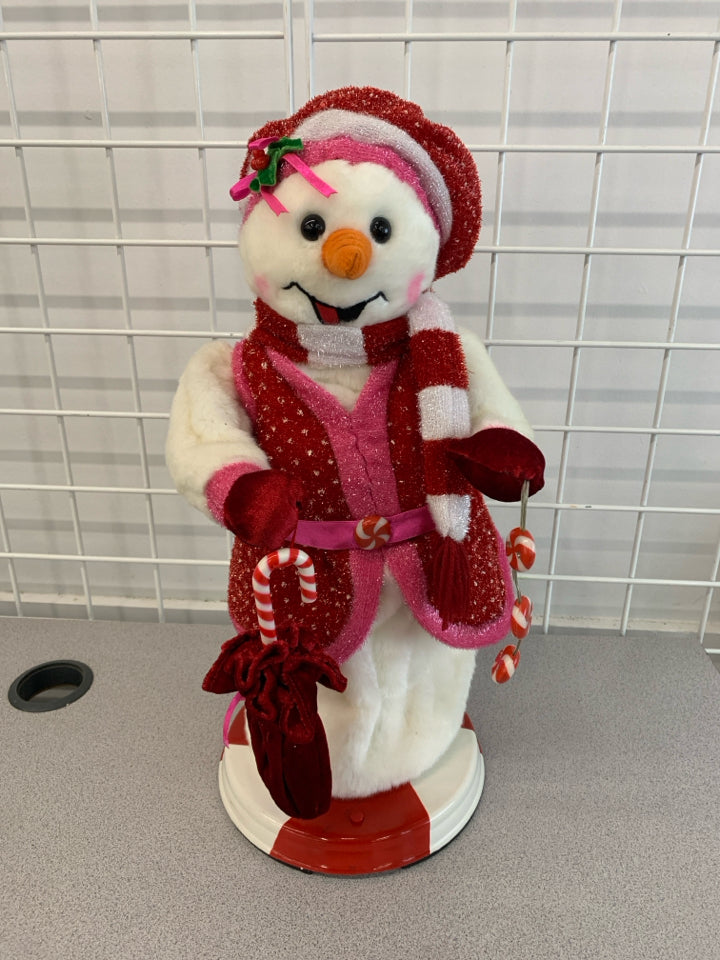TWIRLING MUSICAL SNOWWOMAN.