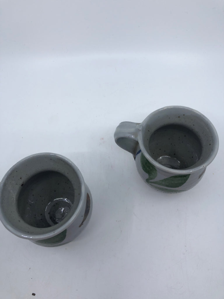 2 GREY POTTERY MUGS W GREEN LEAVES.