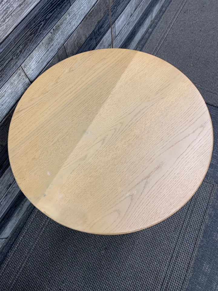 ROUND LIGHT WOOD SIDE TABLE.