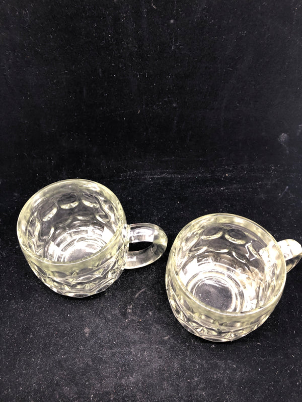 2 HEAVY THUMBPRINT GLASS MUGS.