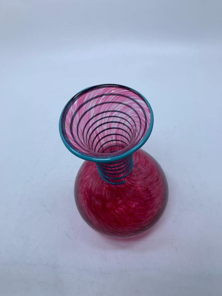 PINK SPECKLED BLOWN GLASS VASE W/ EMBOSSED BLUE SWIRL ON NECK.