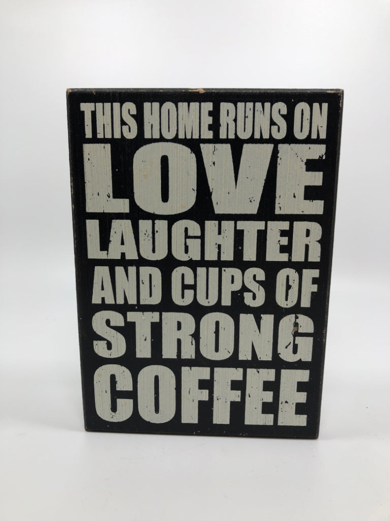 THIS HOME RUNS ON LOVE WOOD SIGN.