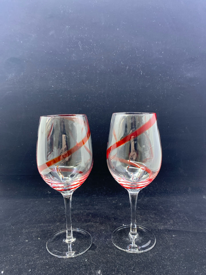 2 LARGE WINE GLASSES W RED SWIRL.