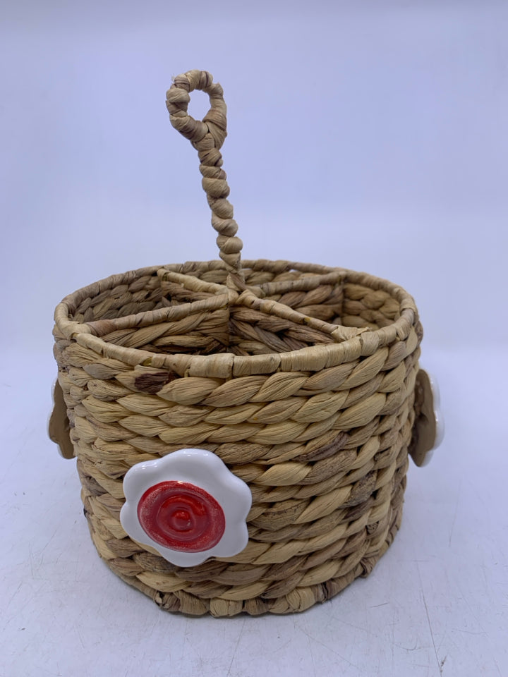 DIVIDED BASKET W/ CERAMIC FLOWERS UTENSIL HOLDER HANDLE IN CENTER.