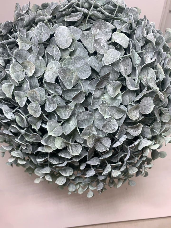 FAUX GREENERY BUSH IN GREY PLASTIC POT.