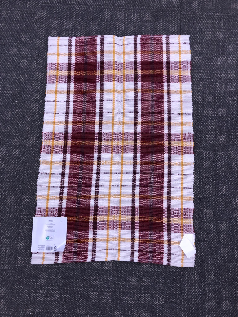 NIP PLAID LAYERING RUG.