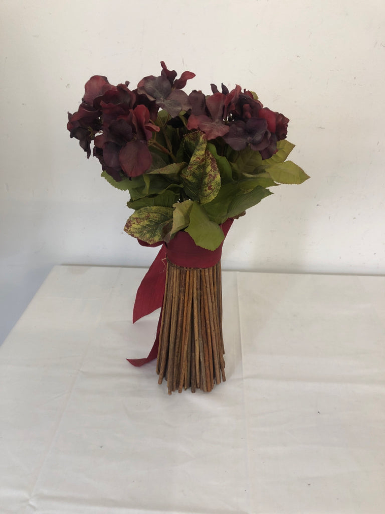 MAROON COLORED FAUX FLOWERS W RED BOW.