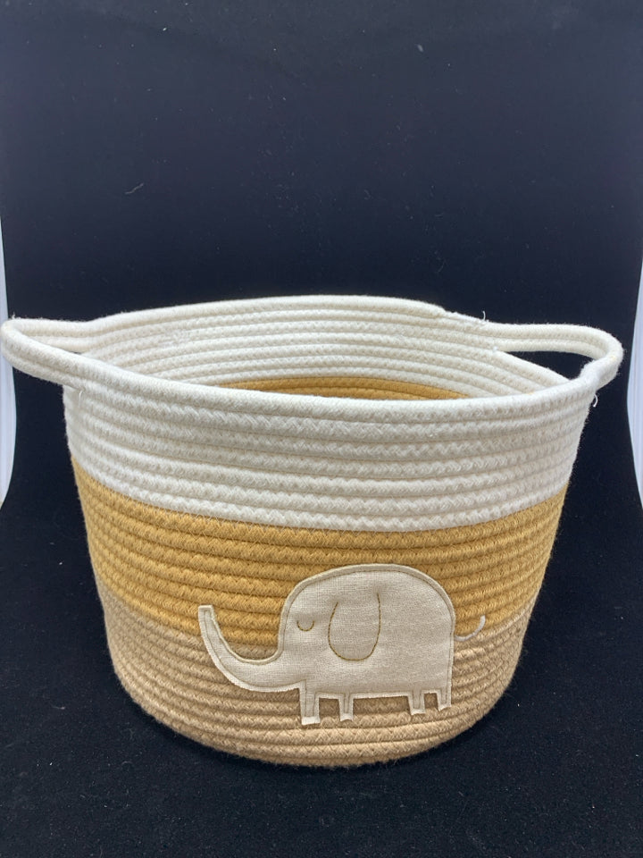 WHITE/TAN FABRIC STORAGE BIN W/ELEPHANT DECAL AND HANDLES.