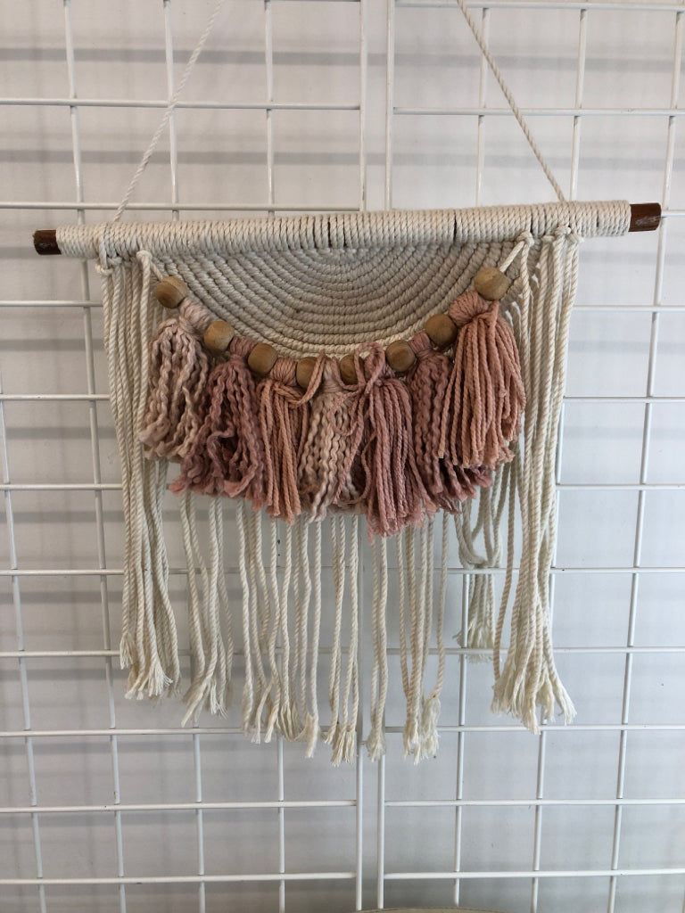 MACRAME ON WOOD DOWEL ROD W/PINK AND BEADED ACCENTS.