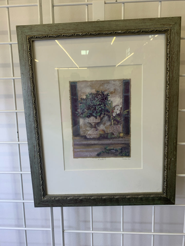 GREEN DISTRESSED FRAME PLANTER AND WHITE FLOWER WALL ART.