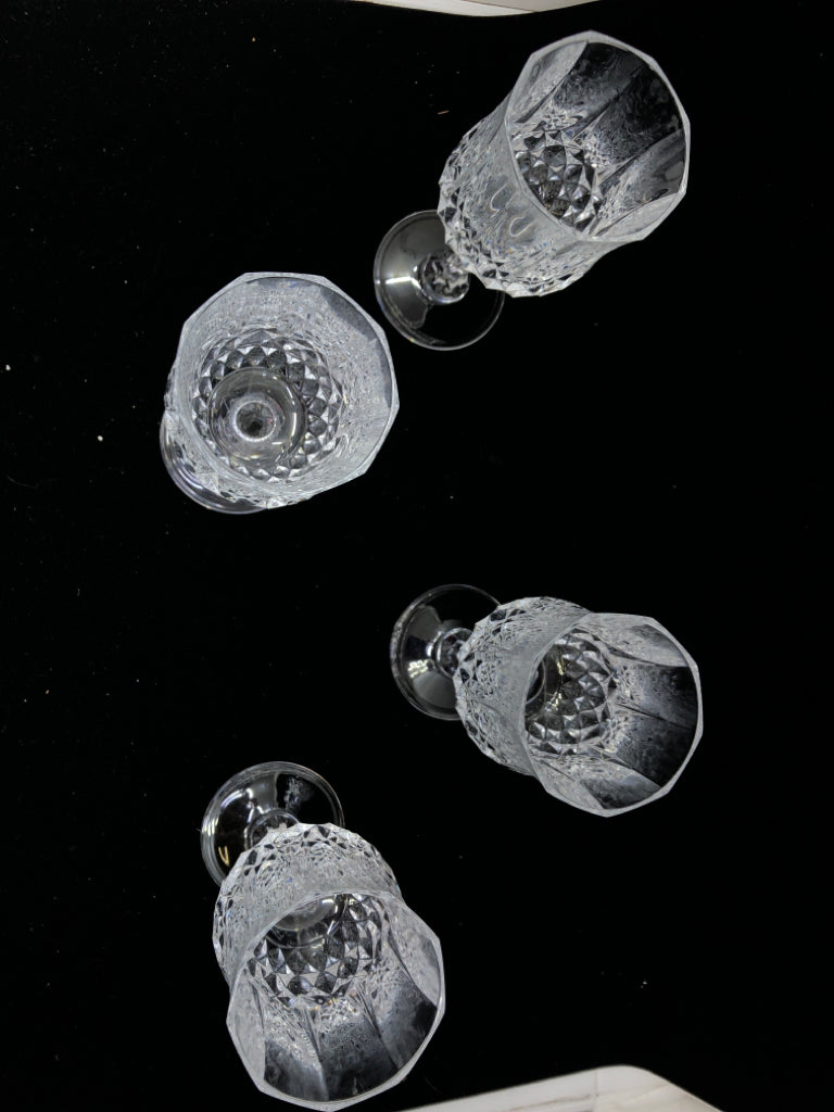 4 TALL CUT CRYSTAL WINE GLASSES.