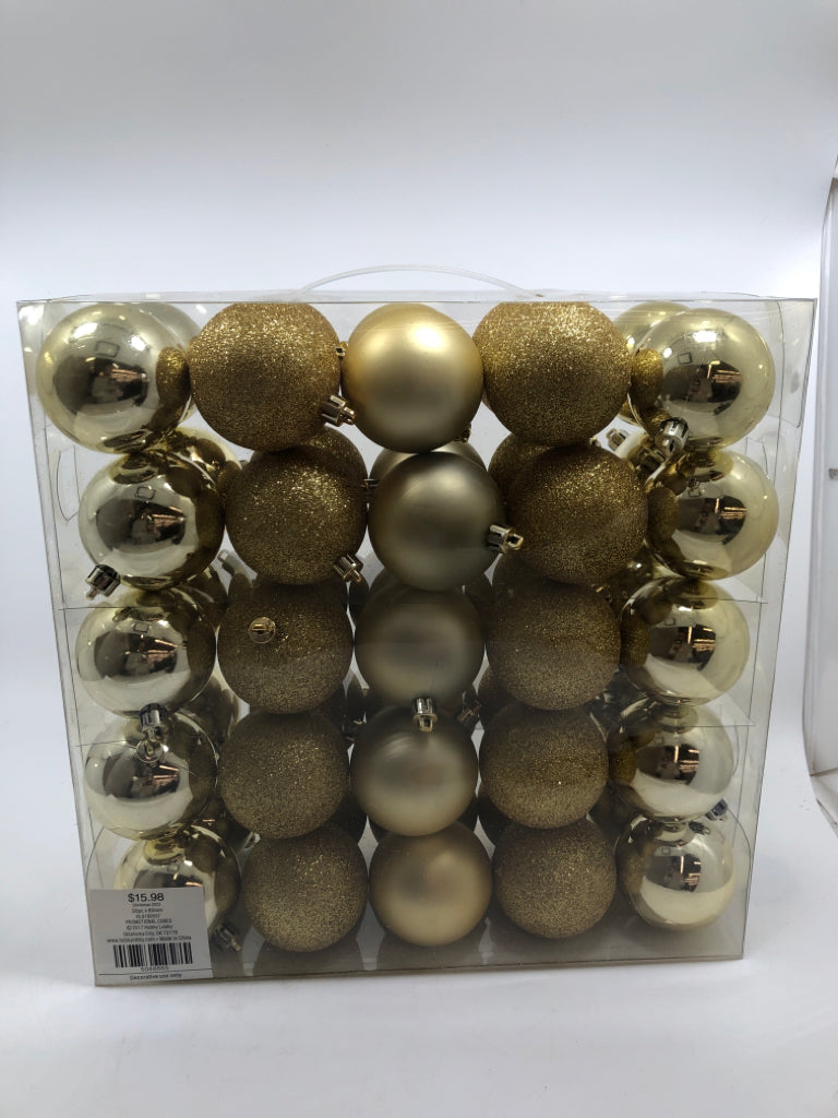 NIP 50PC GOLD ORNAMENTS.