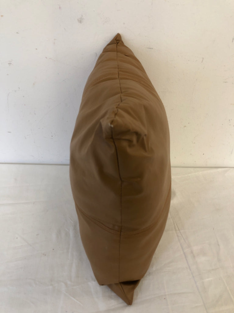 SMALL TAN FAUX LEATHER PILLOW.