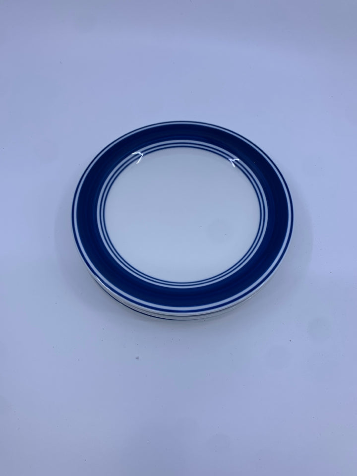 4 BLUE RIMMED DESSERT PLATES.