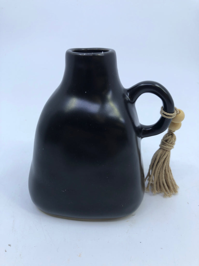 SMALL BLACK JUG/VASE W WOOD BEADS.