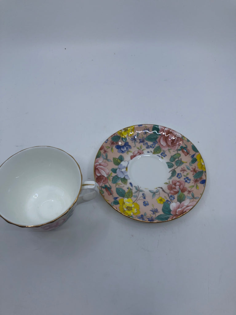 ROYAL KINGSTON PINK BASE W YELLOW FLORAL TEACUP AND SAUCER.