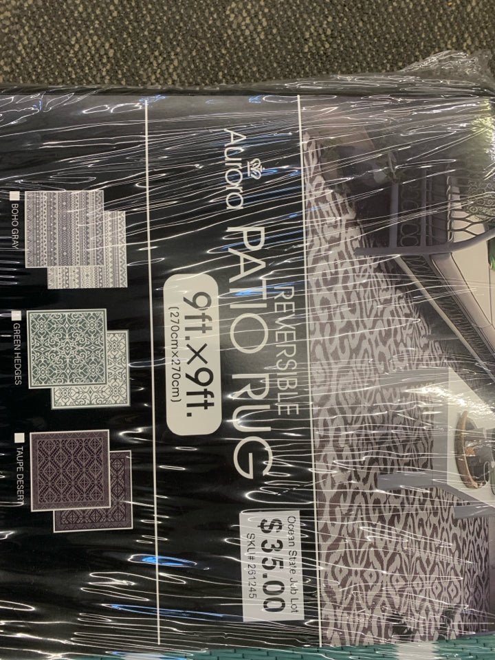 NIP REVERSIBLE PATIO RUG.