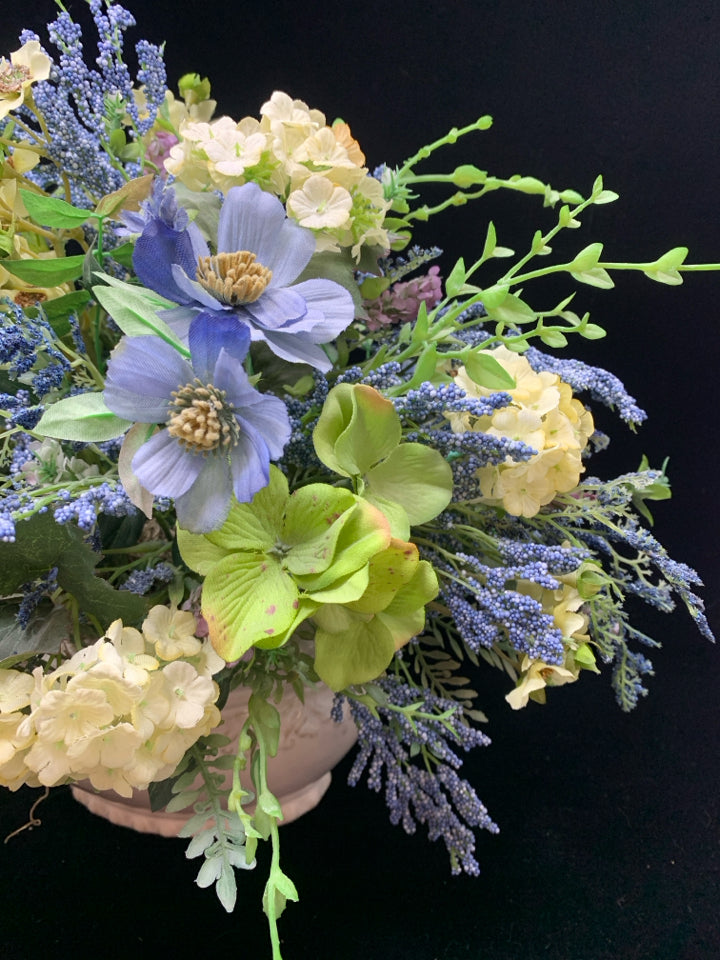 BLUE FLORALS IN WHITE PLANTER.