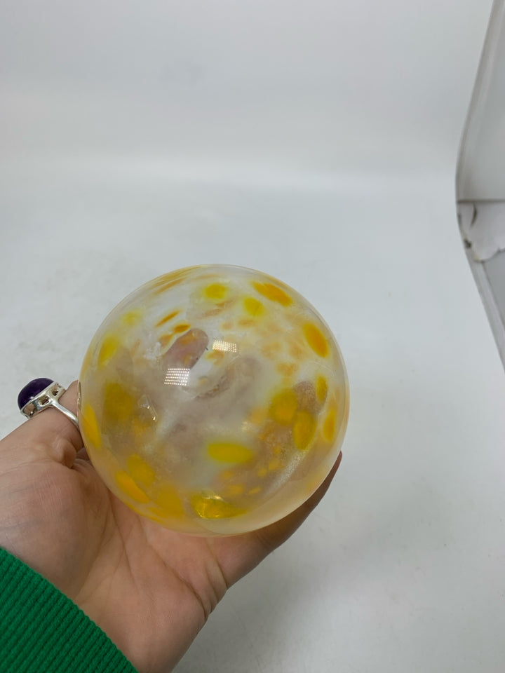BLOWN GLASS CLEAR W/ YELLOW SPECKS ORNAMENT.
