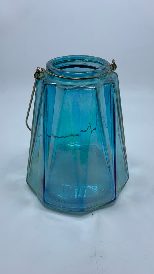 BLUE IRIDESCENT CANDLE HOLDER W/HANDLE.