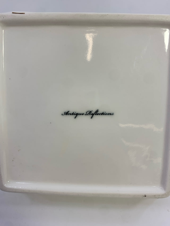 ANTIQUE REFLECTIONS WHITE CERAMIC BASKET W/FLOWER.