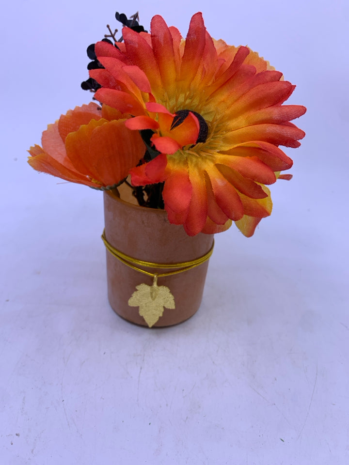 SMALL ORANGE FLORAL ARRANGEMENT.