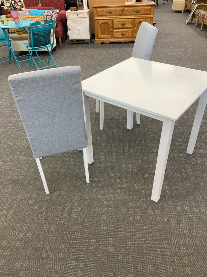 WHITE TABLE W/2 GRAY UPHOLSTERED CHAIRS.