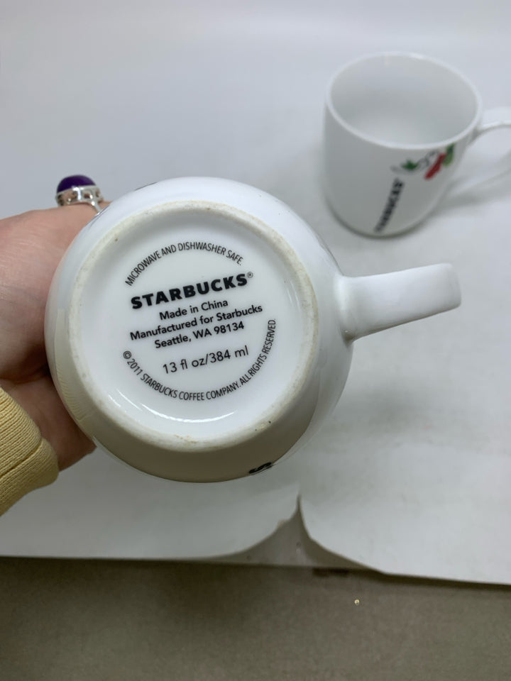 2 WHITE STARBUCKS MUGS W/ MITTENS & DOVE.