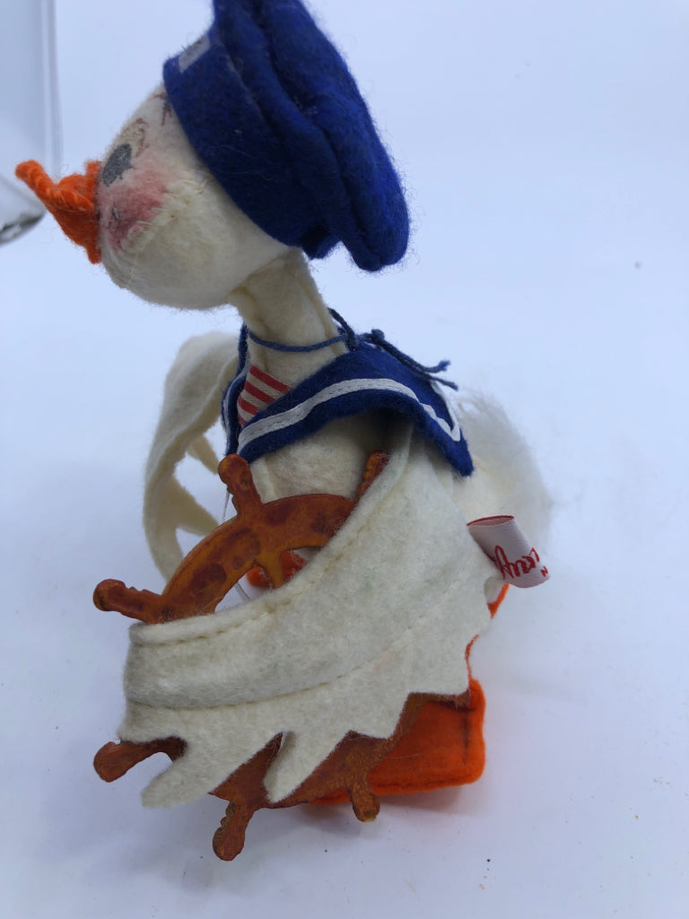 ANNA LEE DUCK HOLDING WHEEL.