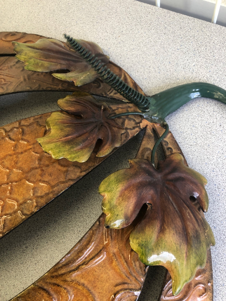 DARK ORANGE METAL SCROLL PUMPKIN WALL ART.