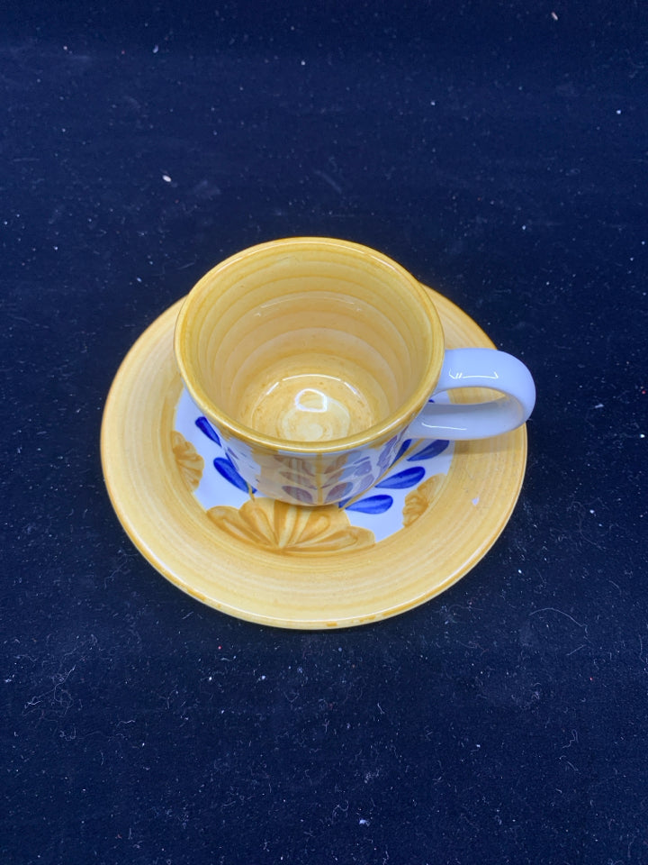 BLUE AND YELLOW FLORAL TEACUP AND SAUCER.