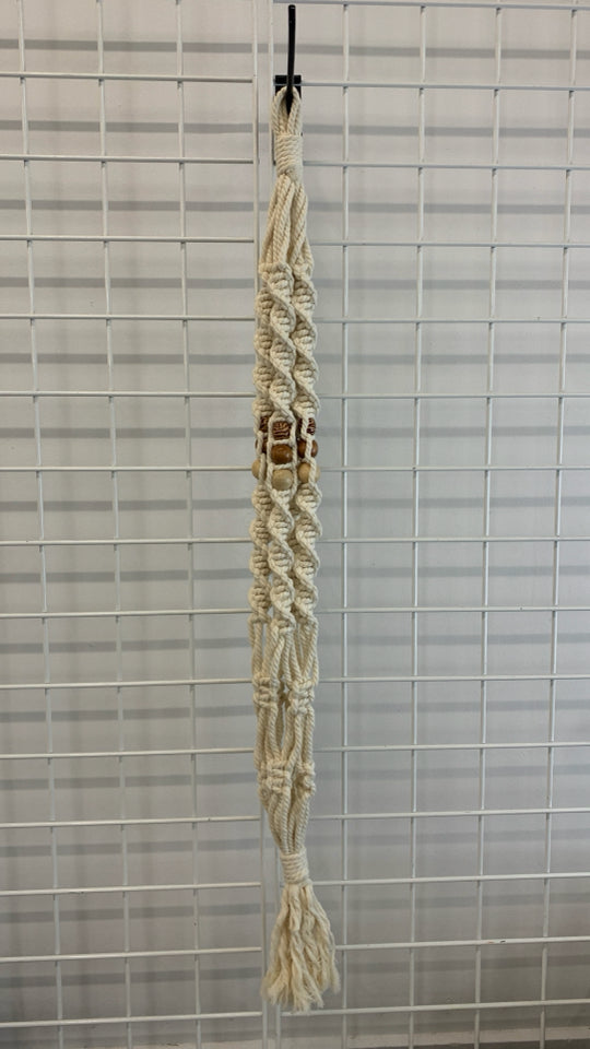 BEADED MACRAME PLANT HOLDER.