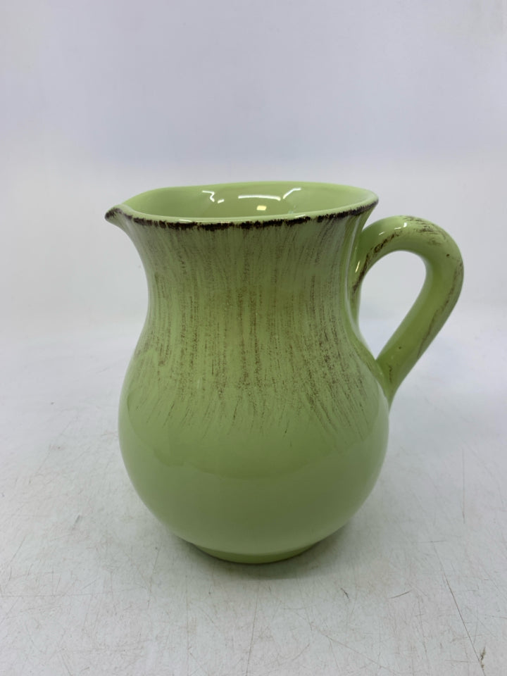 LIGHT GREEN DISTRESSED CERAMIC VASE.