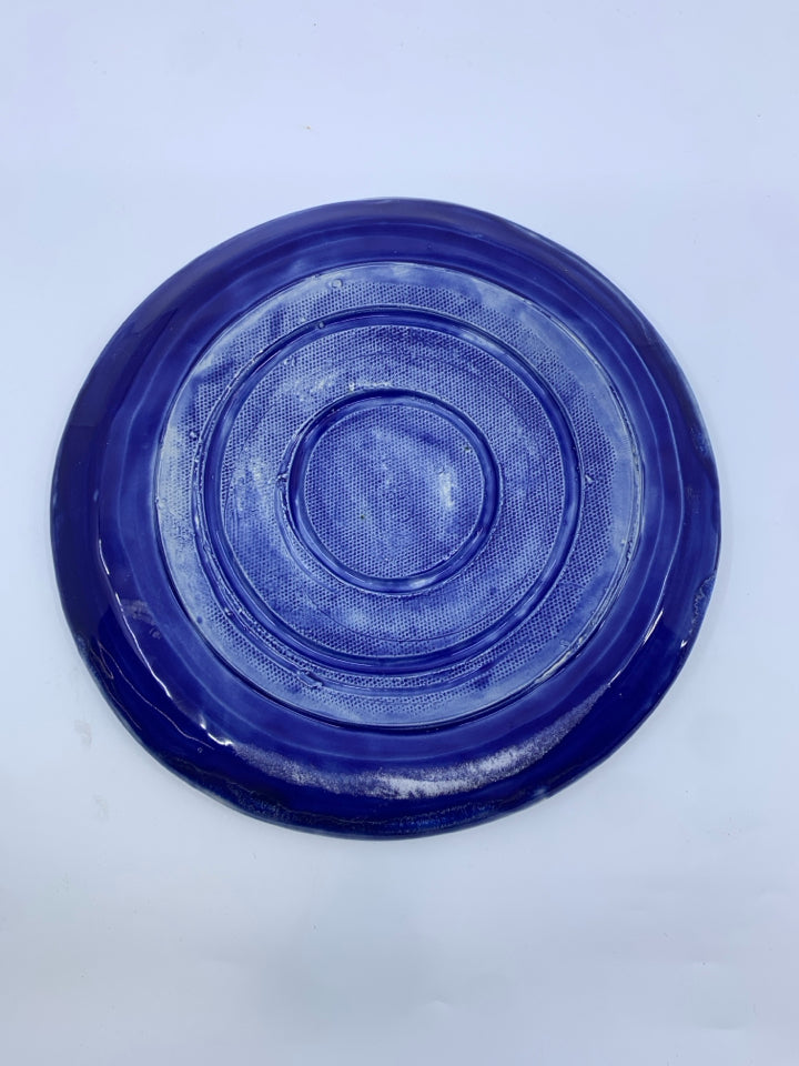 BLUE POTTERY CANDLE PLATE.