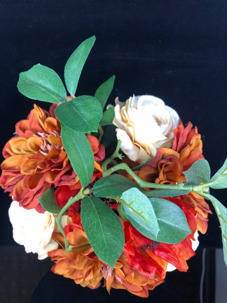 DARK ORANGE/WHITE FAUX ROSES IN YELLOW TINTED GLASS VASE.